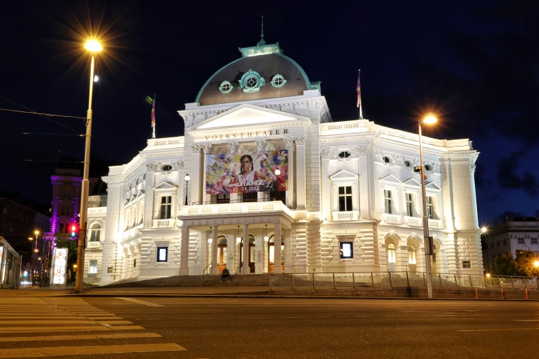 a white building with a lot of lights around it