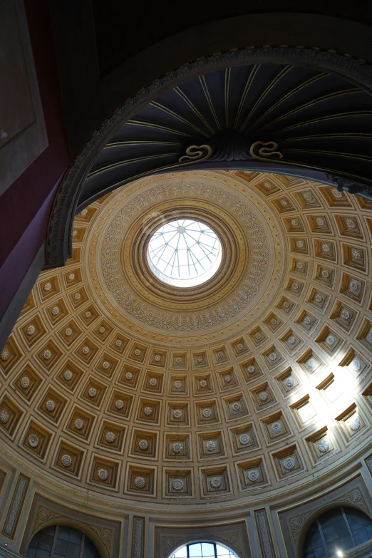 the ceiling inside a church, looking up into the dome