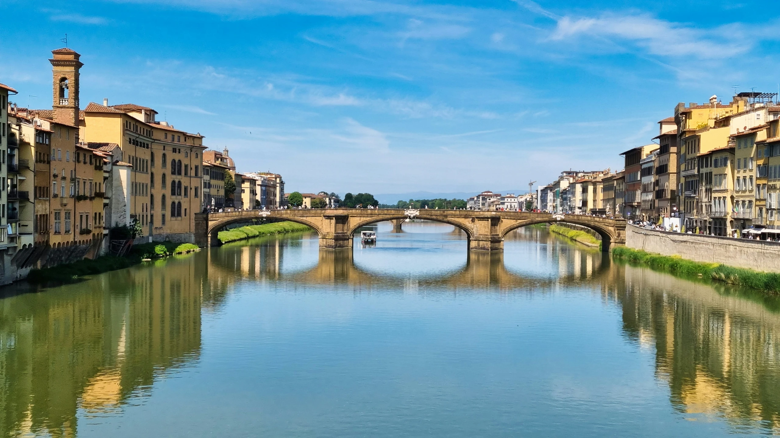 a bridge over a body of water with buildings on both sides of it