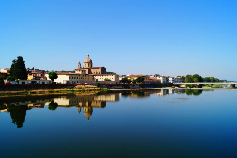 the water in the middle of town is calm and still blue