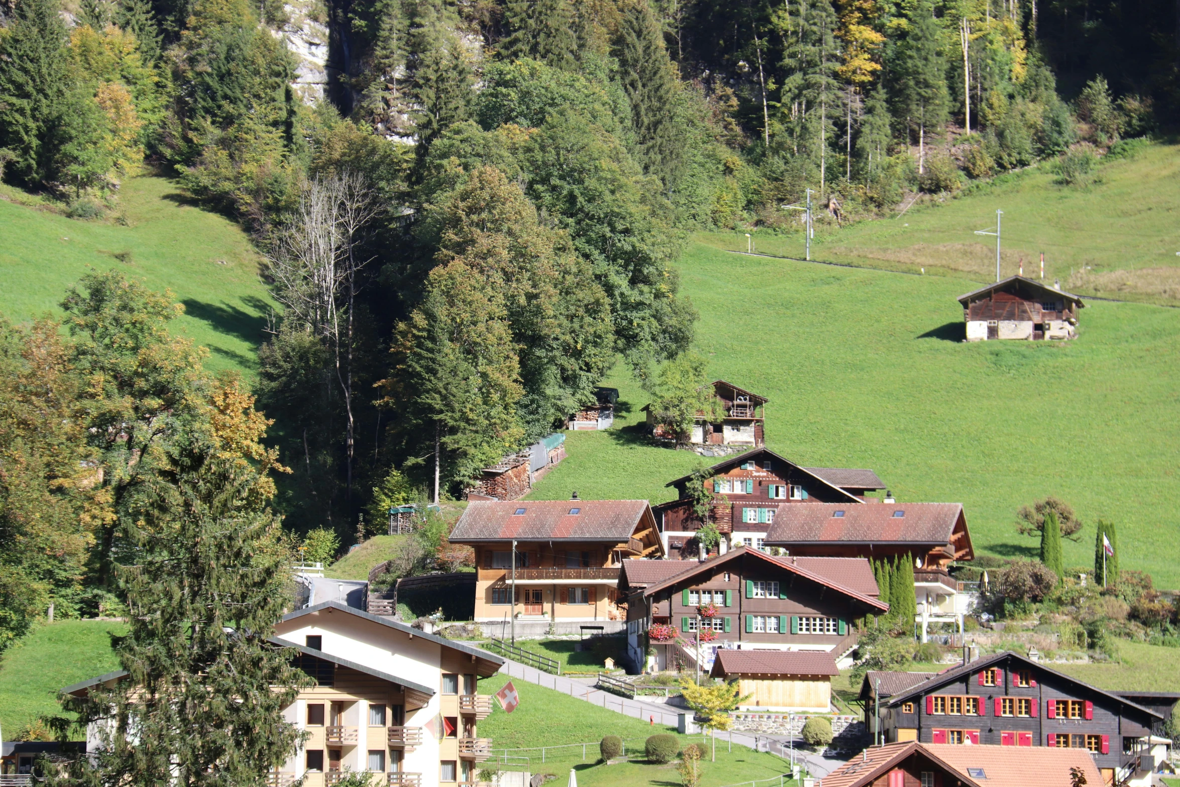 a village in the mountains with some nice houses on top of them