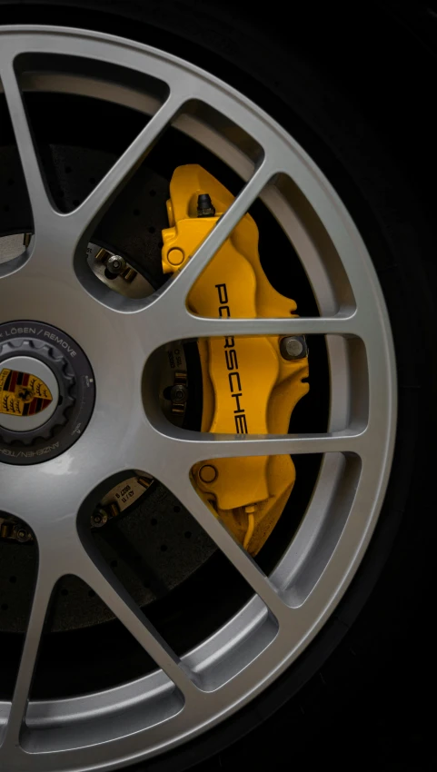 a close up of the spokes and kes on a sports car
