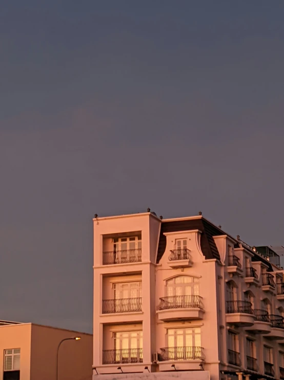 a view of a building on a hillside at night