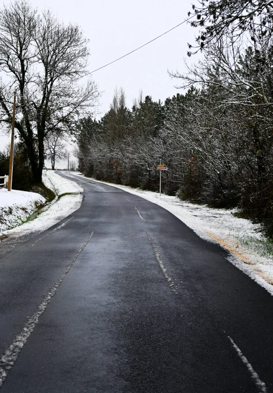 an empty street on a very snowy day