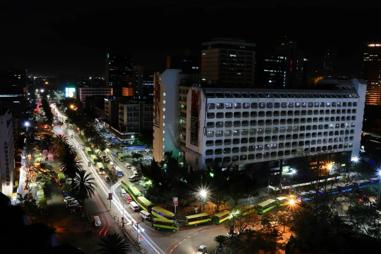 a night s of buildings and streets with trees and other buildings