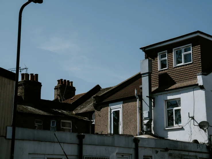 a group of buildings on a street with some signs