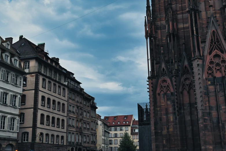 a street with old buildings and church on it