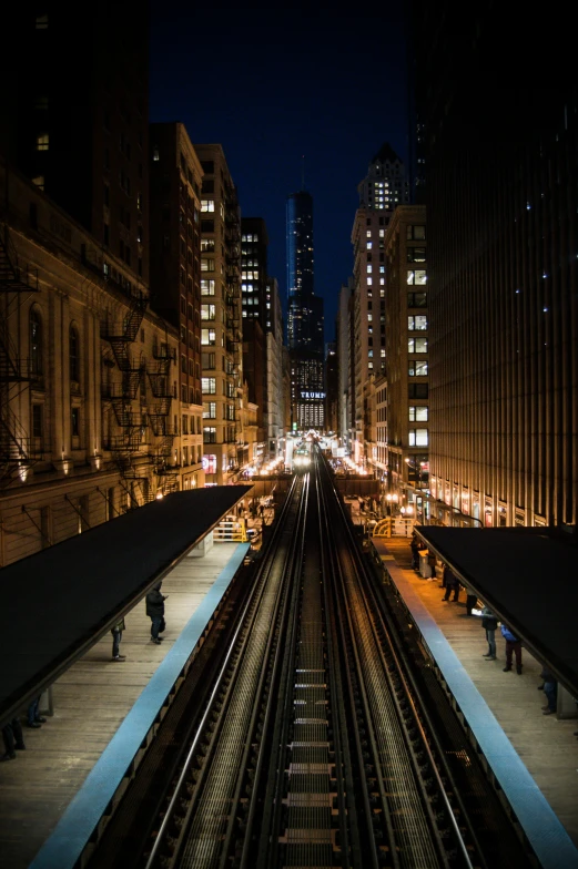 a train station at night in the city