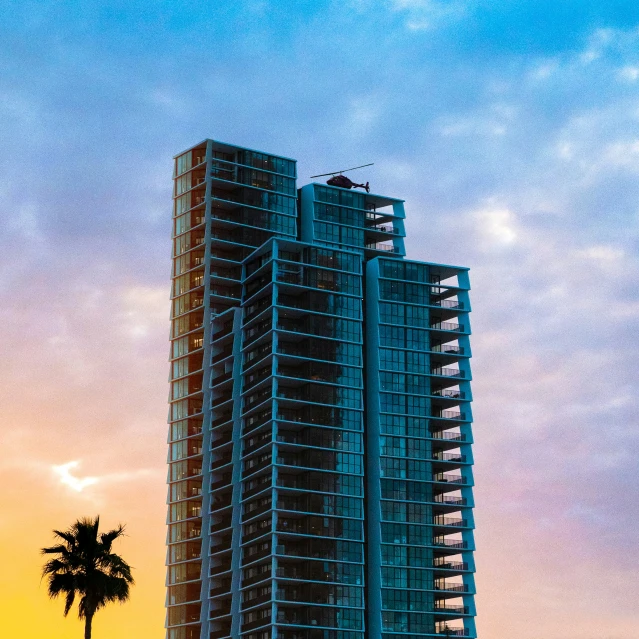 tall buildings near the water at sunset