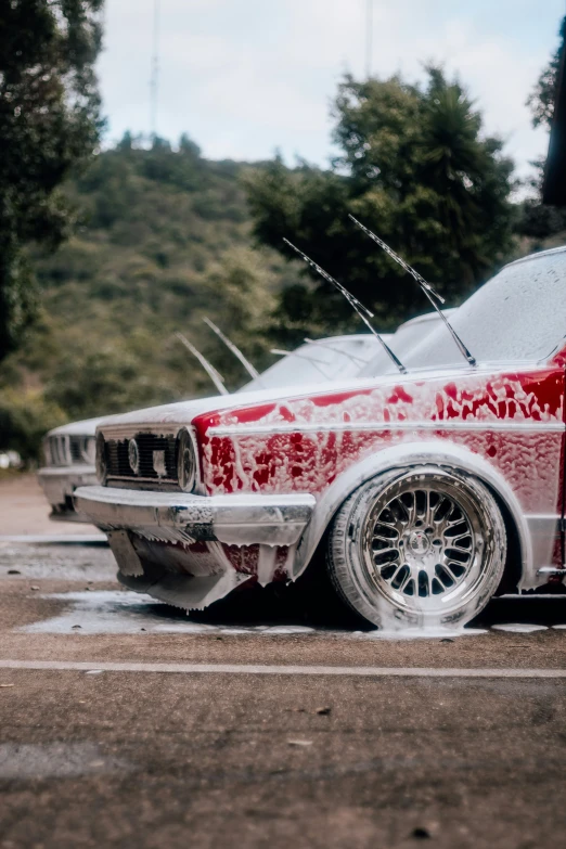 a very old looking car that has been covered in oil