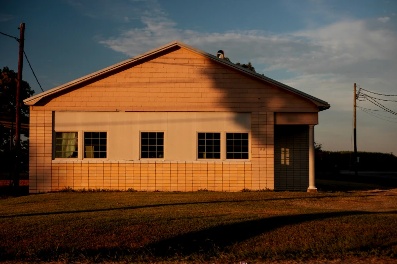 an old building with a short porch and window