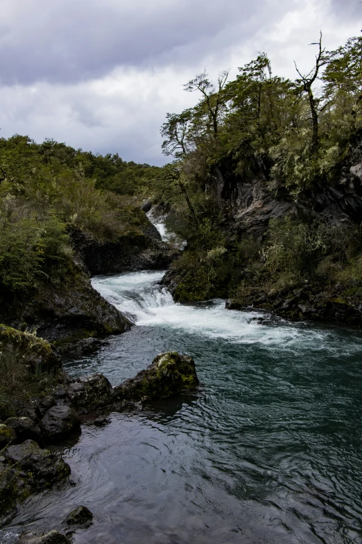 waterfall on the edge of a ravine by itself