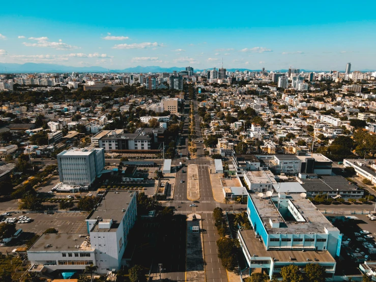 a city with many buildings in it and trees