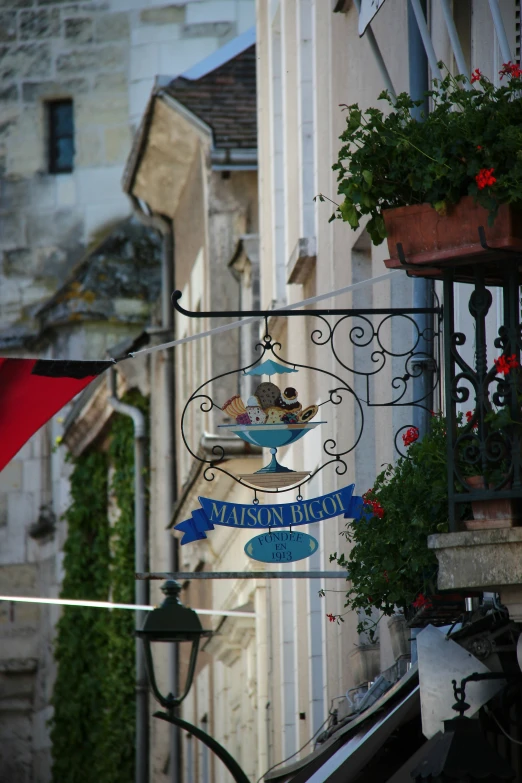 a balcony that is displaying the sign for the restaurant