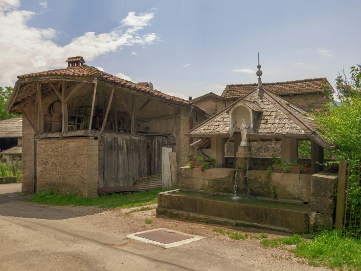 an old building with two fountains in front of it