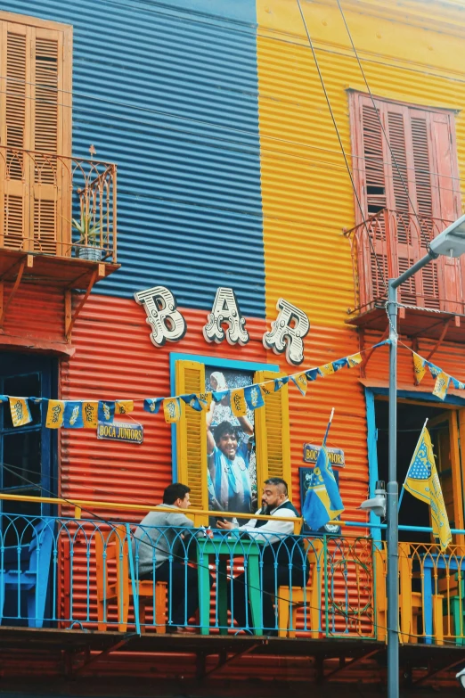 several buildings are painted in bright colors of various styles and colors