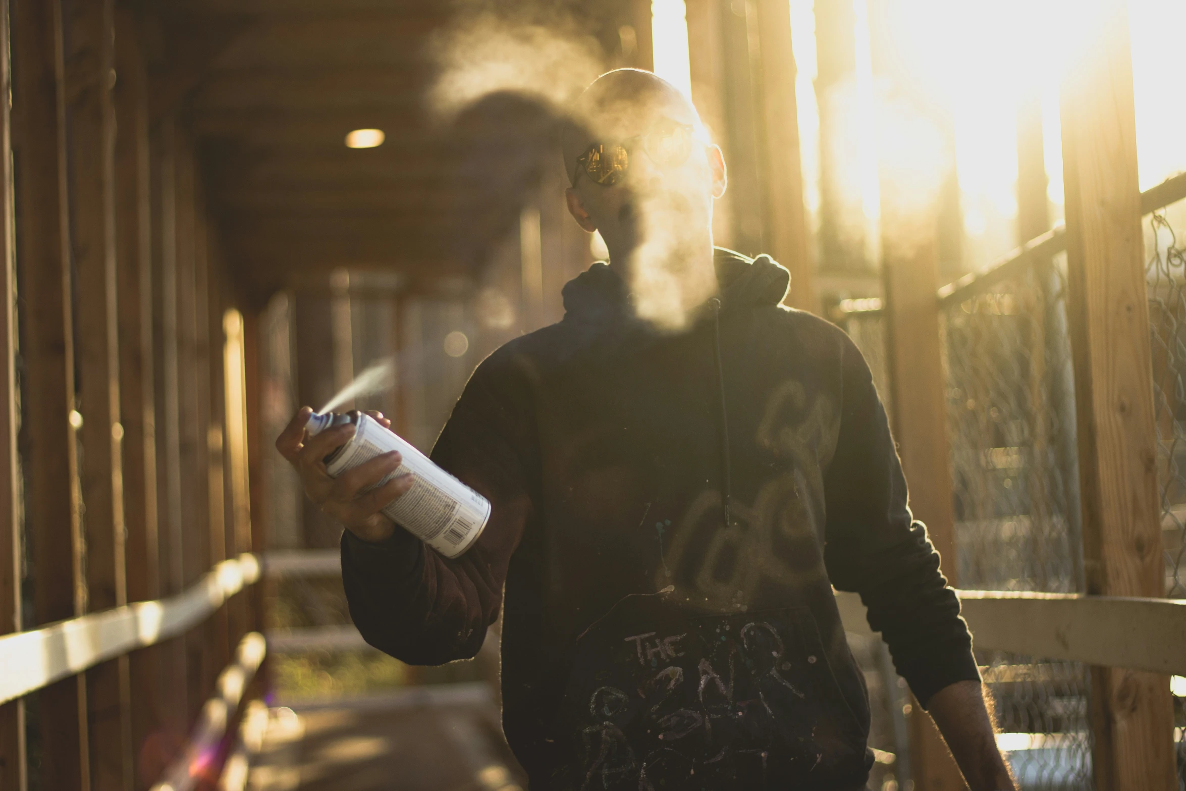 a man with smoke and an electric cigarette