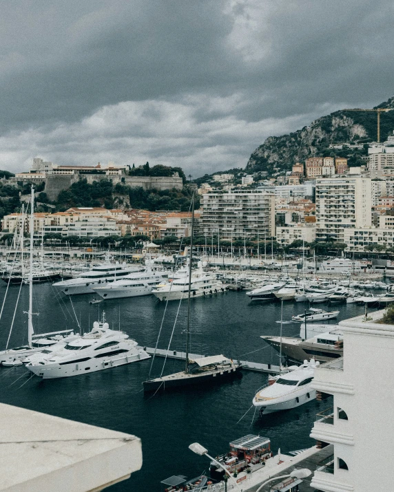 boats are docked in the water with buildings on either side