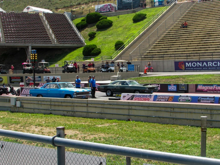 there is a large stage that is set up for several cars