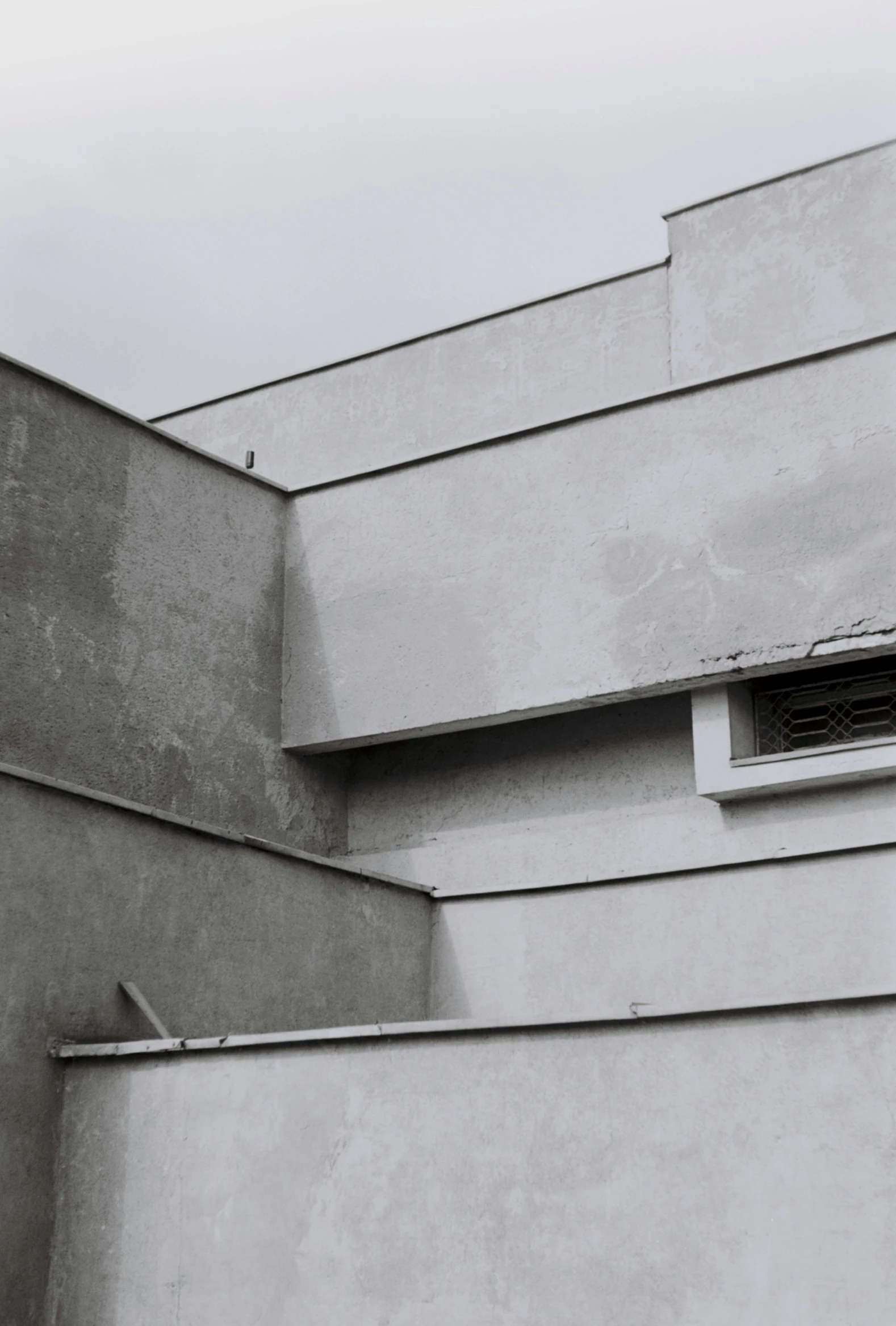 an air conditioner on the side of an industrial building