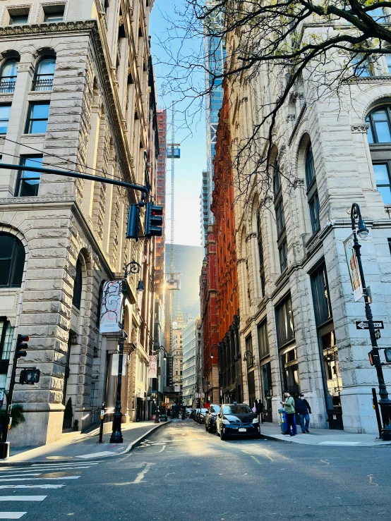 a very tall white building sitting on the side of a road