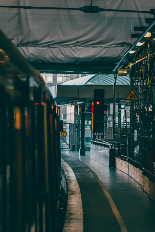 there is a train going down the track in the station