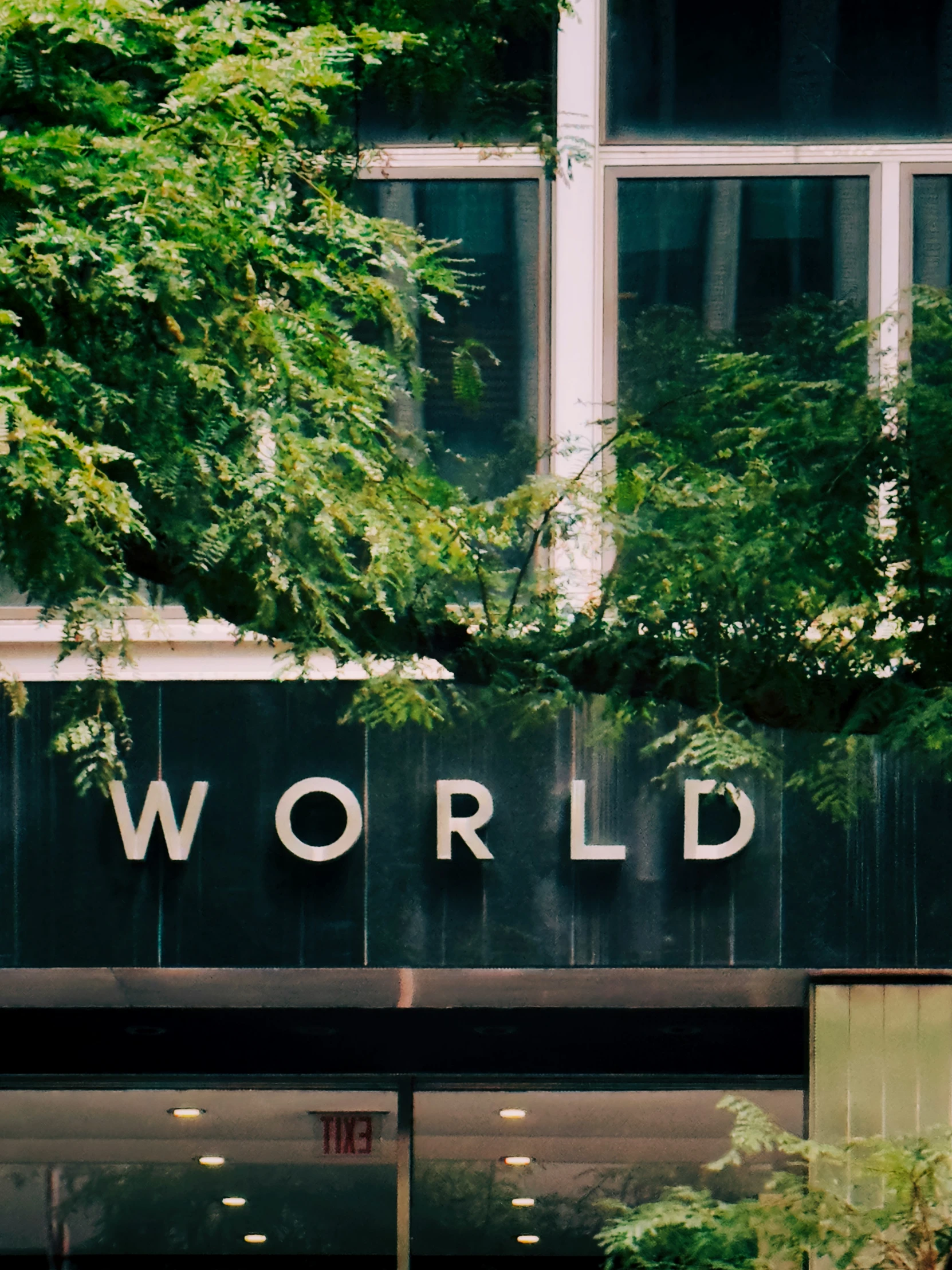 a picture of the building sign on a street