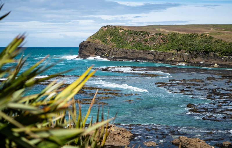 an ocean view near the shoreline with cliffs