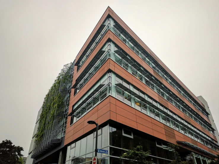 a tall building with a lot of balconies and many windows