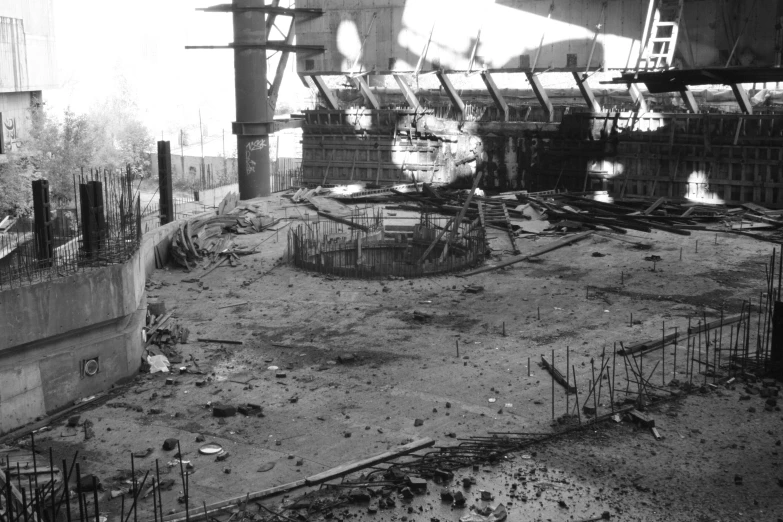 black and white pograph of a fire pit with ladders in it