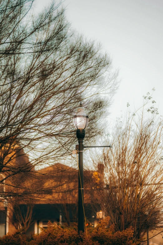 a clock sitting on top of a street light