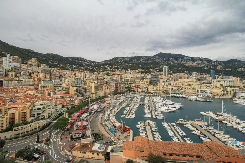 many boats are parked in the water beside buildings