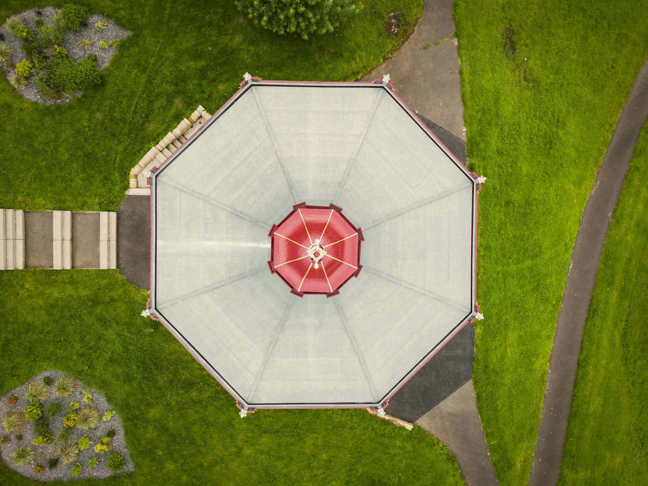 an overhead view of an umbrella in the grass