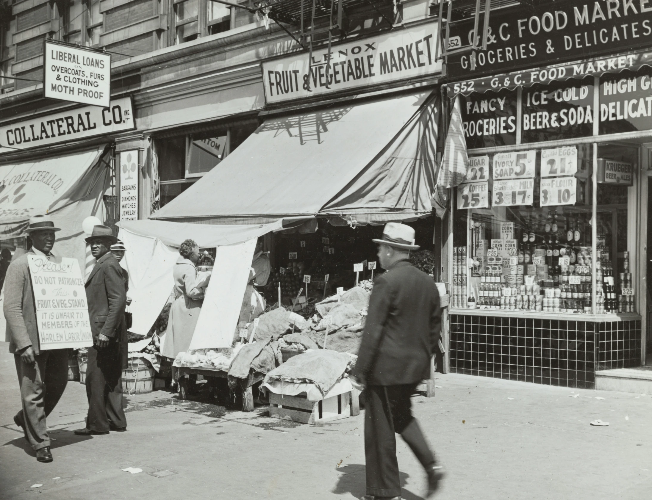 two men are talking outside in front of a market