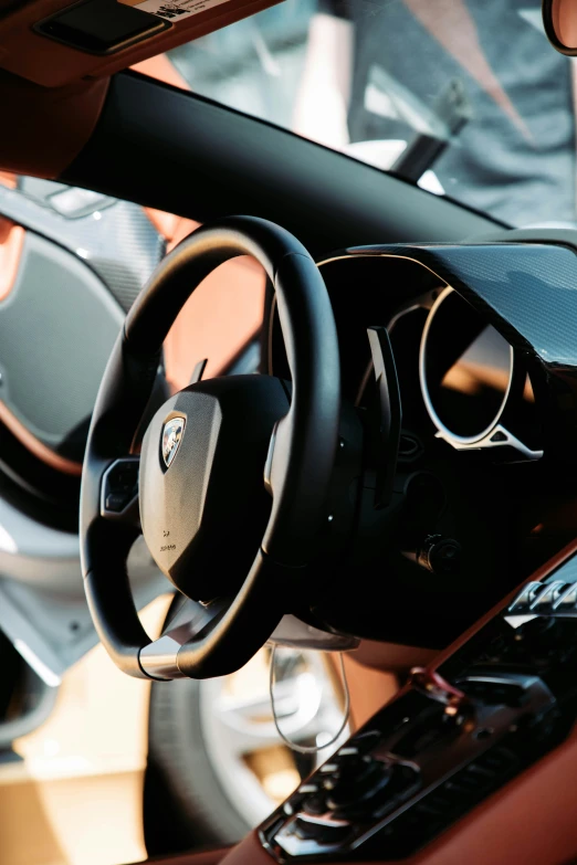 an automobile steering wheel and a dashboard with electronic controls