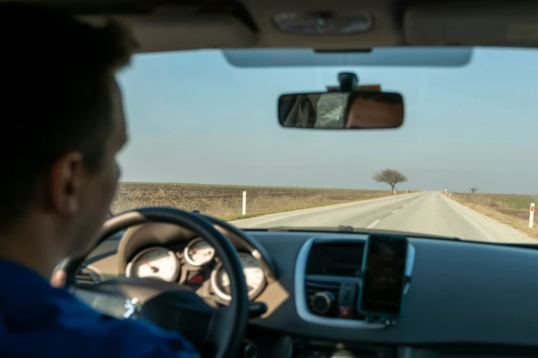 a road in the distance with car driving