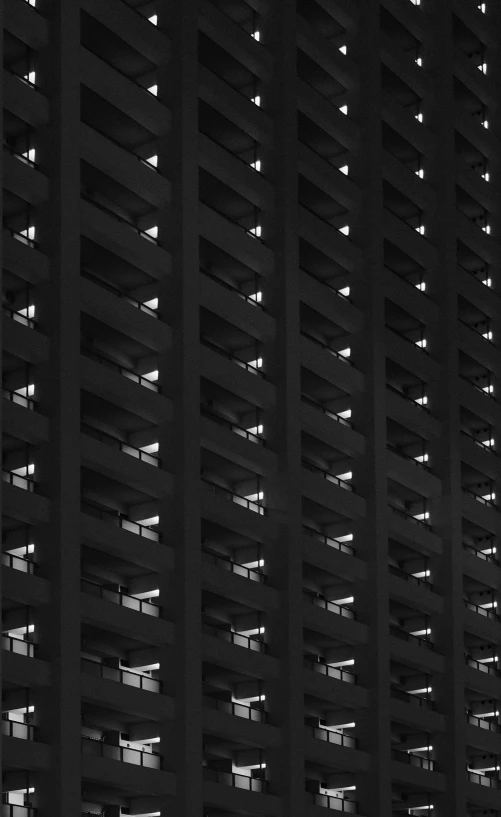 an upward view of a large building at night