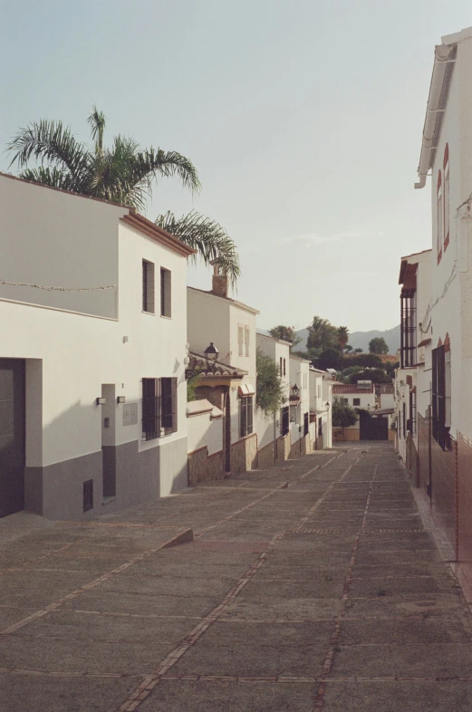 there is a row of buildings on the side of the road