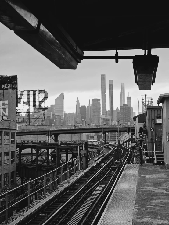 black and white po of the view of the city with a train