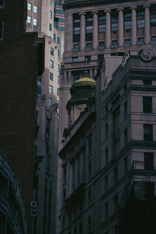 a building is seen in the foreground with other buildings