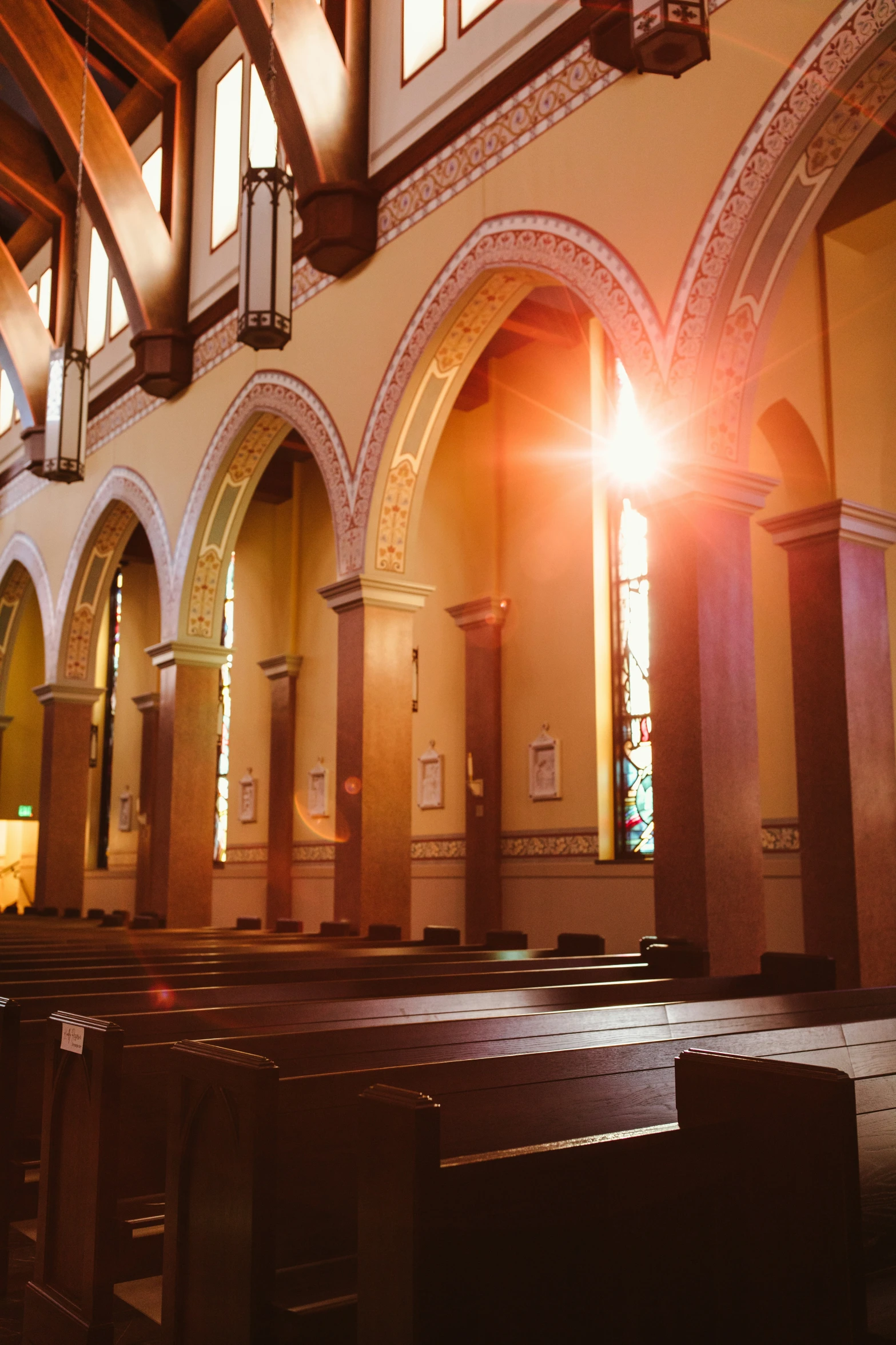 the sunlight shines through the tall windows in a church