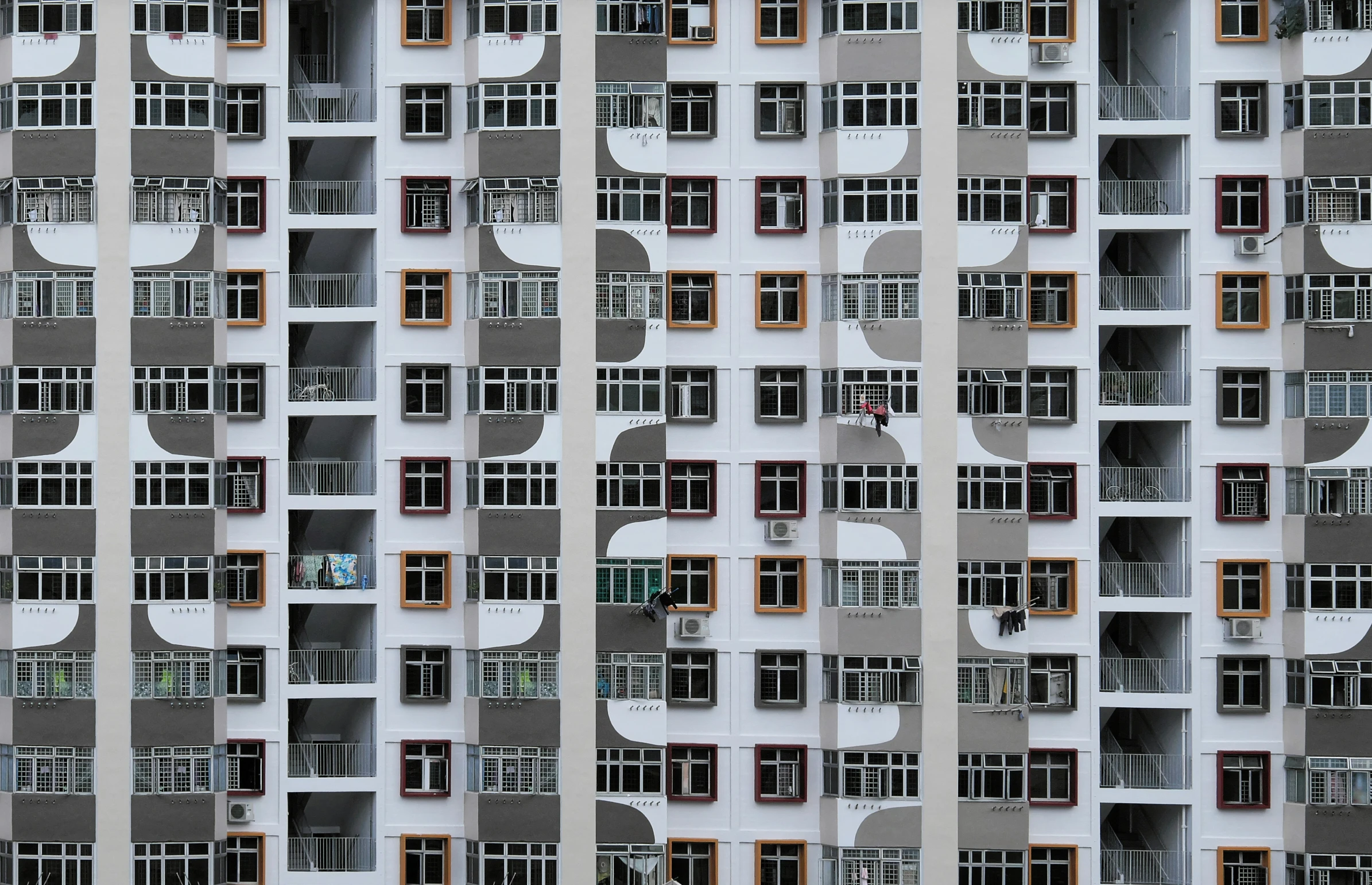 the building is tall and very tall and has many windows