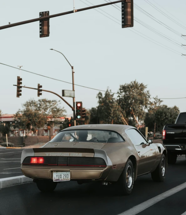 a car is driving down the road at an intersection