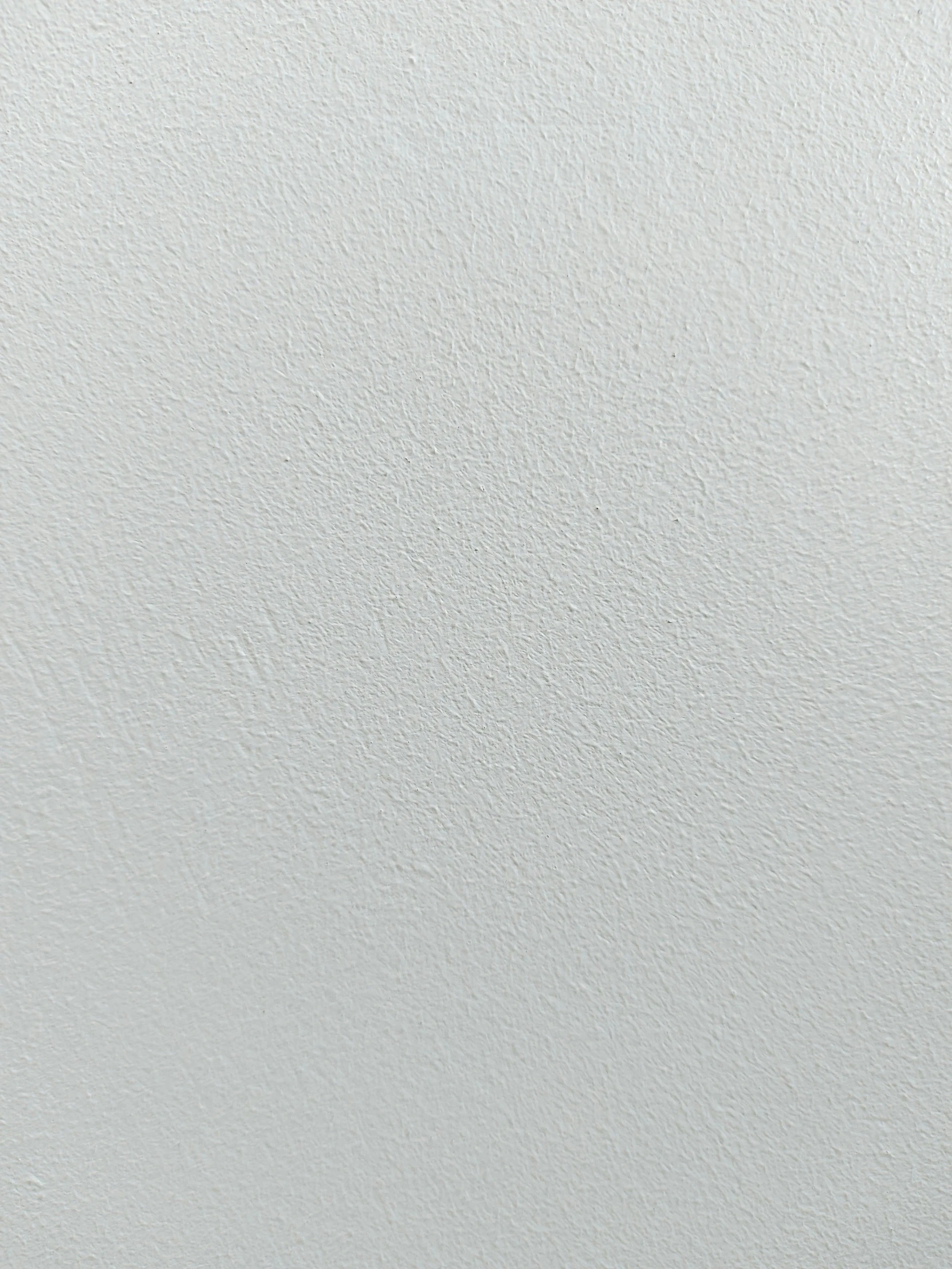 the background of an almost white painted surface