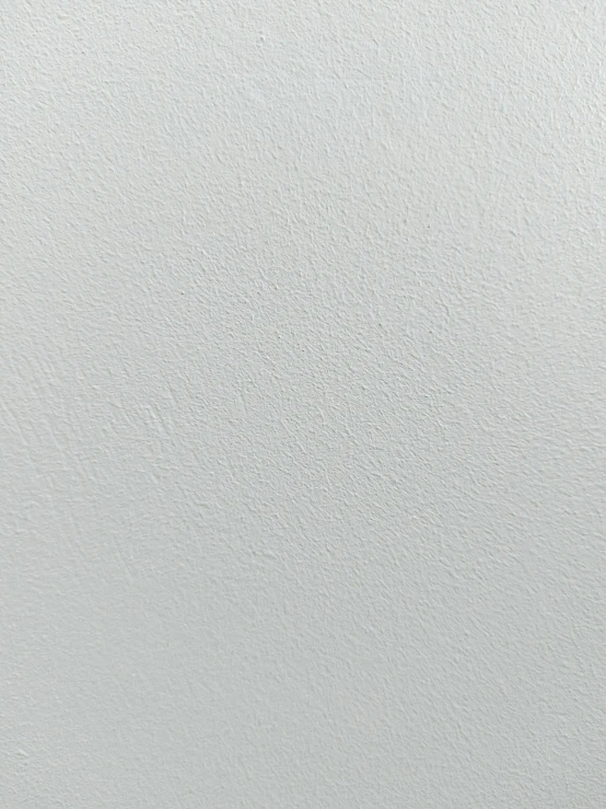 the background of an almost white painted surface