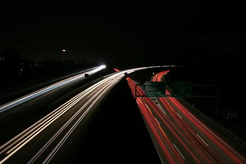 long exposure ss of cars passing on an empty highway