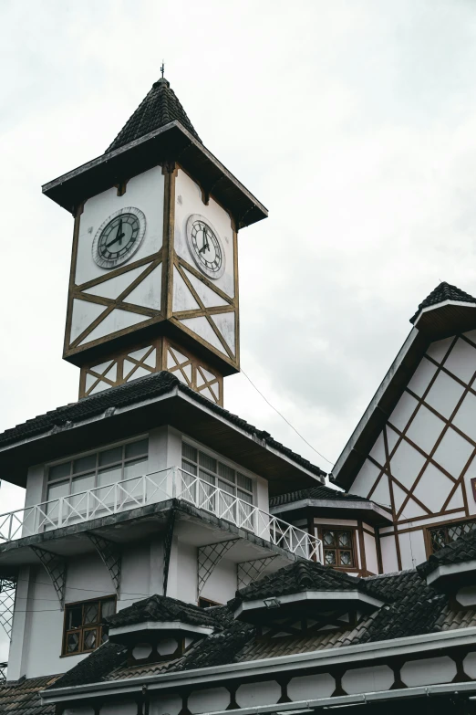 a tall clock tower above buildings in a city