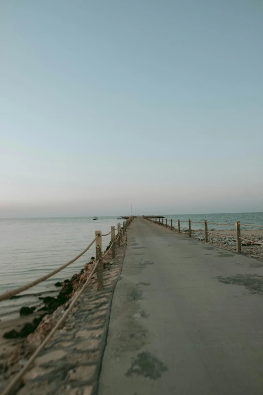 a fence that is next to a body of water