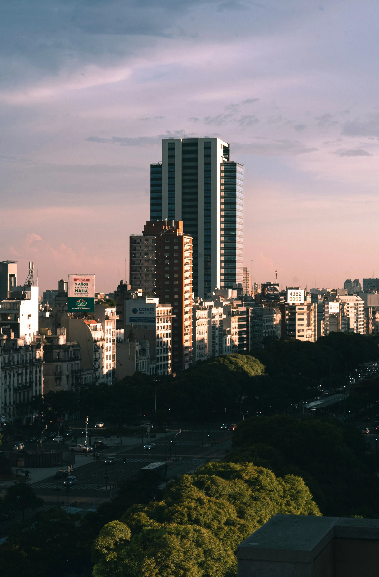 the city skyline is shown at dusk from high above