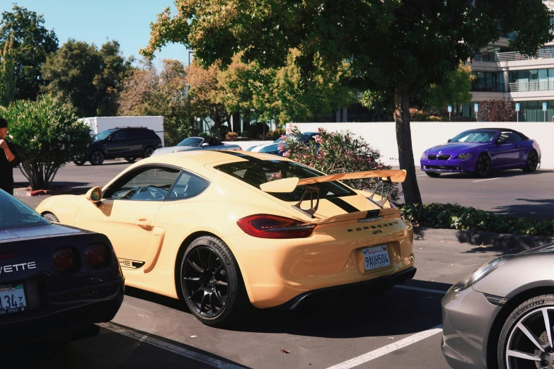 an orange sports car parked in a parking lot